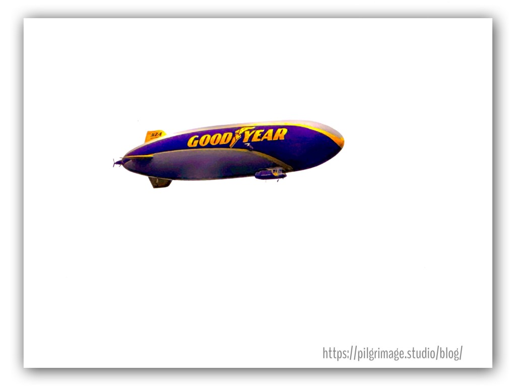 Good Year Blimp flying in a cloudy sky