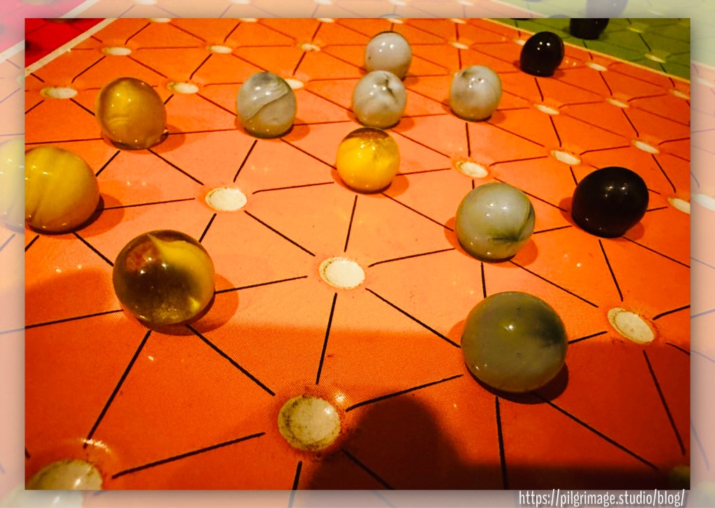 Chinese checkers board with colorful marbles